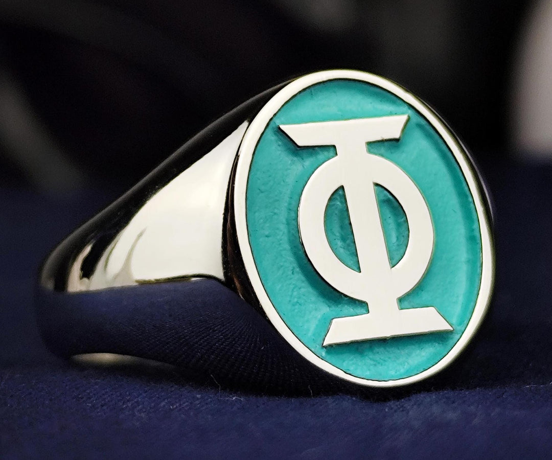 A sophisticated and stylish oval signet ring featuring custom engraving options for business logos, personal symbols, or special emblems. This custom-designed piece is available in gold or silver, making it a refined accessory for professionals. Whether worn as a statement ring or gifted as an heirloom, it represents identity, prestige, and exclusivity in a luxurious design.