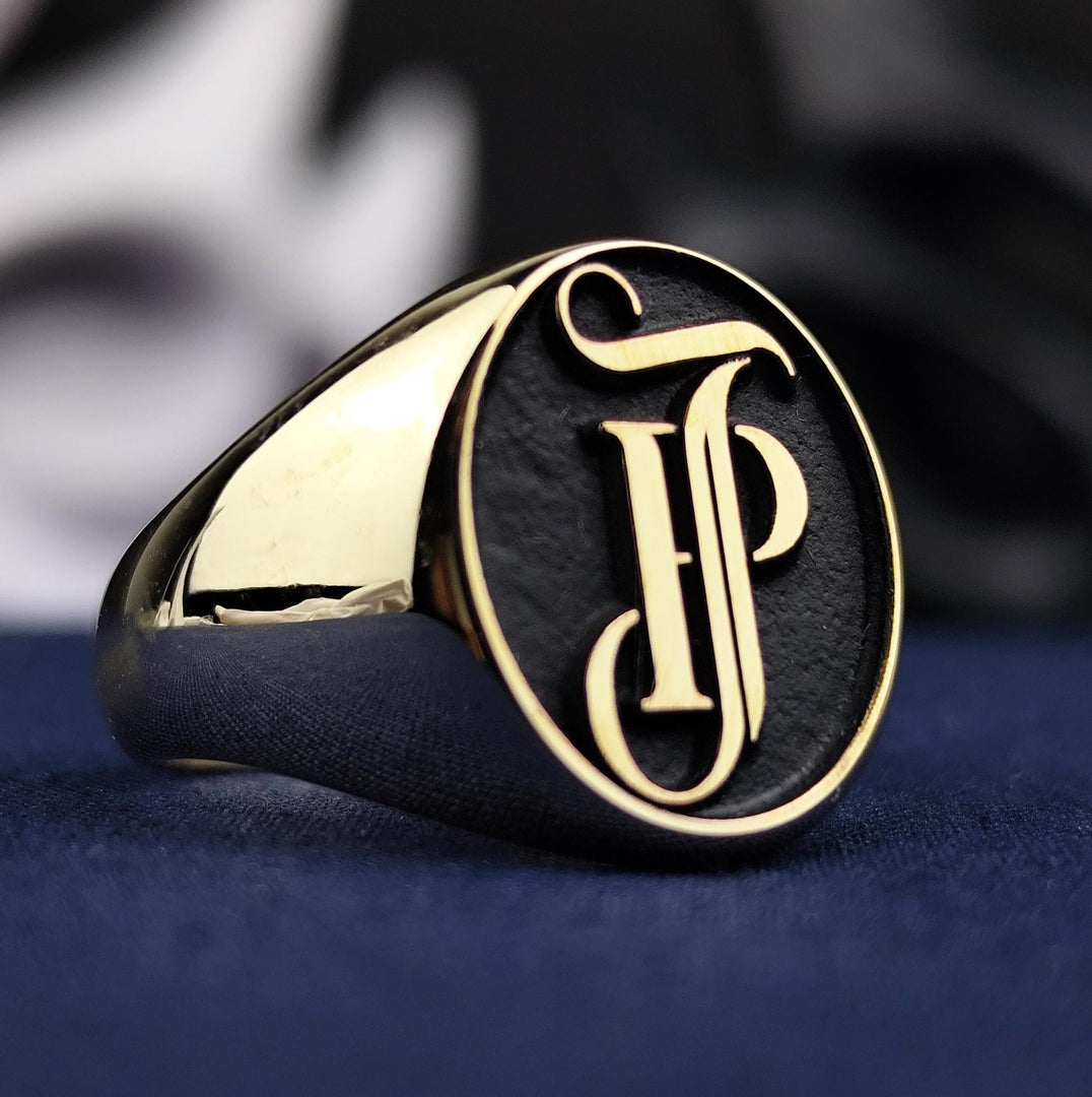 A stunning 14K gold name and surname ring with an intricate monogram engraving, designed as a seal-style statement piece. This elegant and luxurious ring is perfect for men or women who value fine craftsmanship and personal symbolism. It captures the beauty of gold with a lasting message in a unique and wearable form.