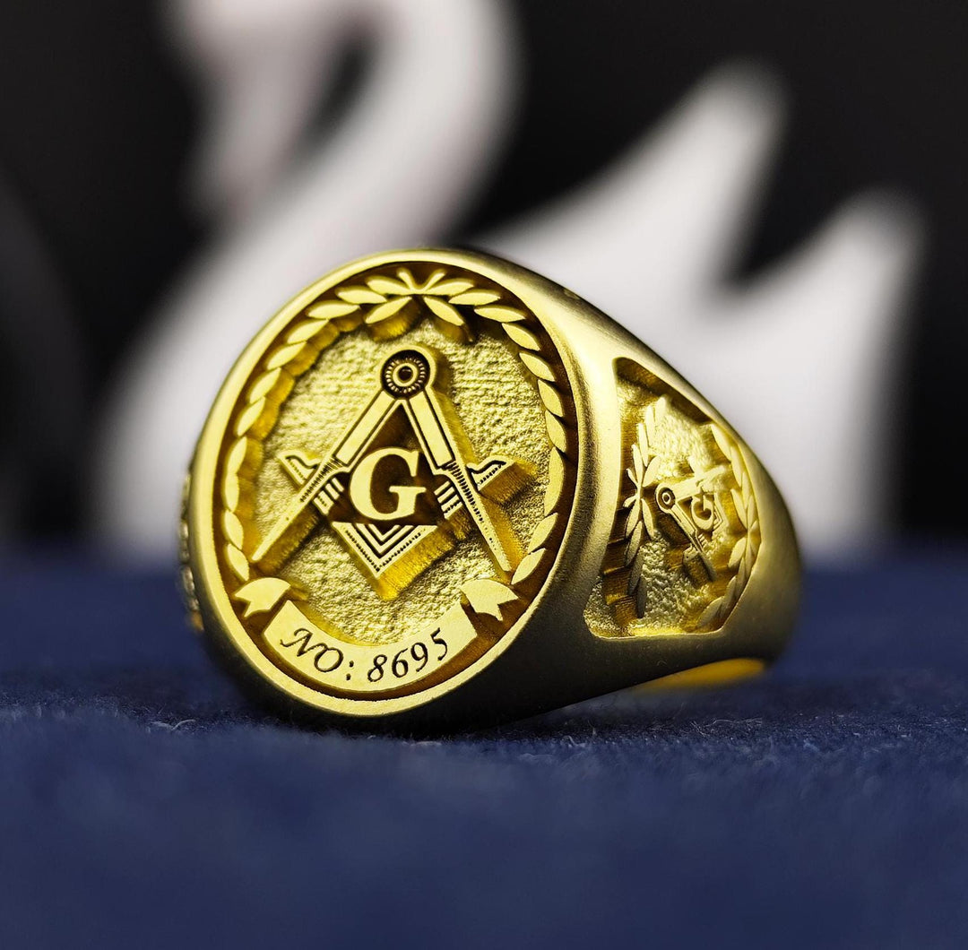 This elegant vermeil Masonic ring is crafted for Freemasons who seek a meaningful and sophisticated signet. Engraved with a custom lodge number, this gold-plated Freemason ring symbolizes brotherhood and tradition. Designed for men, this unique Masonic jewelry piece features intricate craftsmanship, making it a perfect gift for Master Masons, new initiates, or lifelong members who want to showcase their dedication with pride and style.