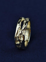 Load image into Gallery viewer, Crafted from solid 14K gold, this rustic ring is a tribute to natural beauty and artisanal craftsmanship. The hand-textured surface gives it an organic, weathered look, making it an ideal choice for those who appreciate unique and understated jewelry. A perfect wedding band, commitment ring, or everyday accessory for those seeking timeless, minimalist style.