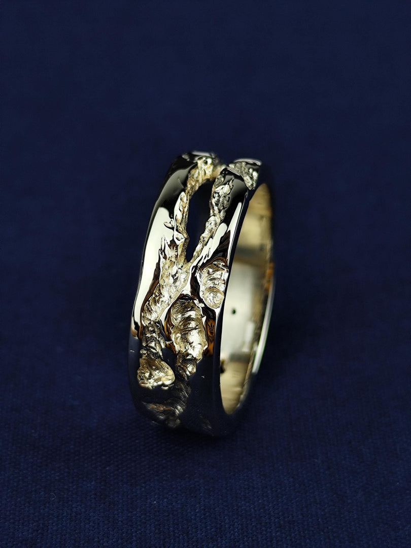 Crafted from solid 14K gold, this rustic ring is a tribute to natural beauty and artisanal craftsmanship. The hand-textured surface gives it an organic, weathered look, making it an ideal choice for those who appreciate unique and understated jewelry. A perfect wedding band, commitment ring, or everyday accessory for those seeking timeless, minimalist style.