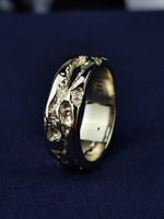Load image into Gallery viewer, A refined yet rustic 14K gold ring, designed with a rough-textured surface for an artisanal, natural feel. Perfect as a wedding band or a stacking ring, this handcrafted solid gold piece is a blend of minimalism and organic beauty. A unique jewelry piece for men and women who appreciate raw, earthy elegance in their accessories.