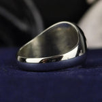 Load image into Gallery viewer, A timeless custom silver family crest ring with a round signet face, featuring deep engraving and black enamel accents. This heraldic ring is an elegant representation of lineage, making it a unique and personal heirloom. Crafted for durability and style, this noble signet ring is a perfect accessory for history enthusiasts and those who appreciate personalized jewelry.