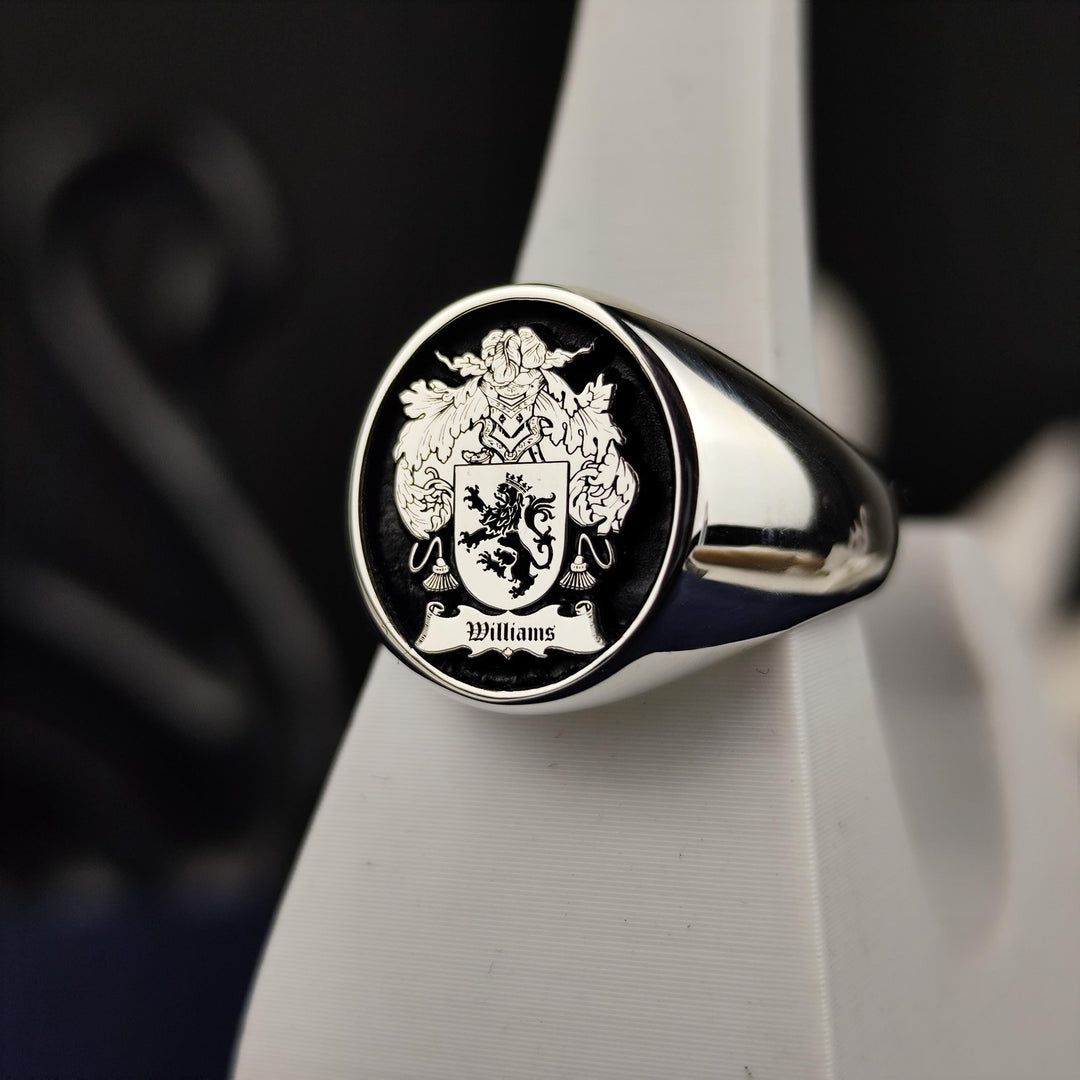 Celebrate your noble lineage with this custom silver crest ring, featuring an engraved family coat of arms highlighted with black enamel. This round signet ring is an elegant and meaningful piece, crafted for those who appreciate their history. A perfect heirloom jewelry piece that serves as a reminder of heritage, pride, and family legacy.