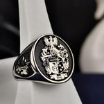 Load image into Gallery viewer, Custom family ring crafted in high-quality silver, featuring a bold coat of arms design. A timeless accessory for daily wear or formal occasions.