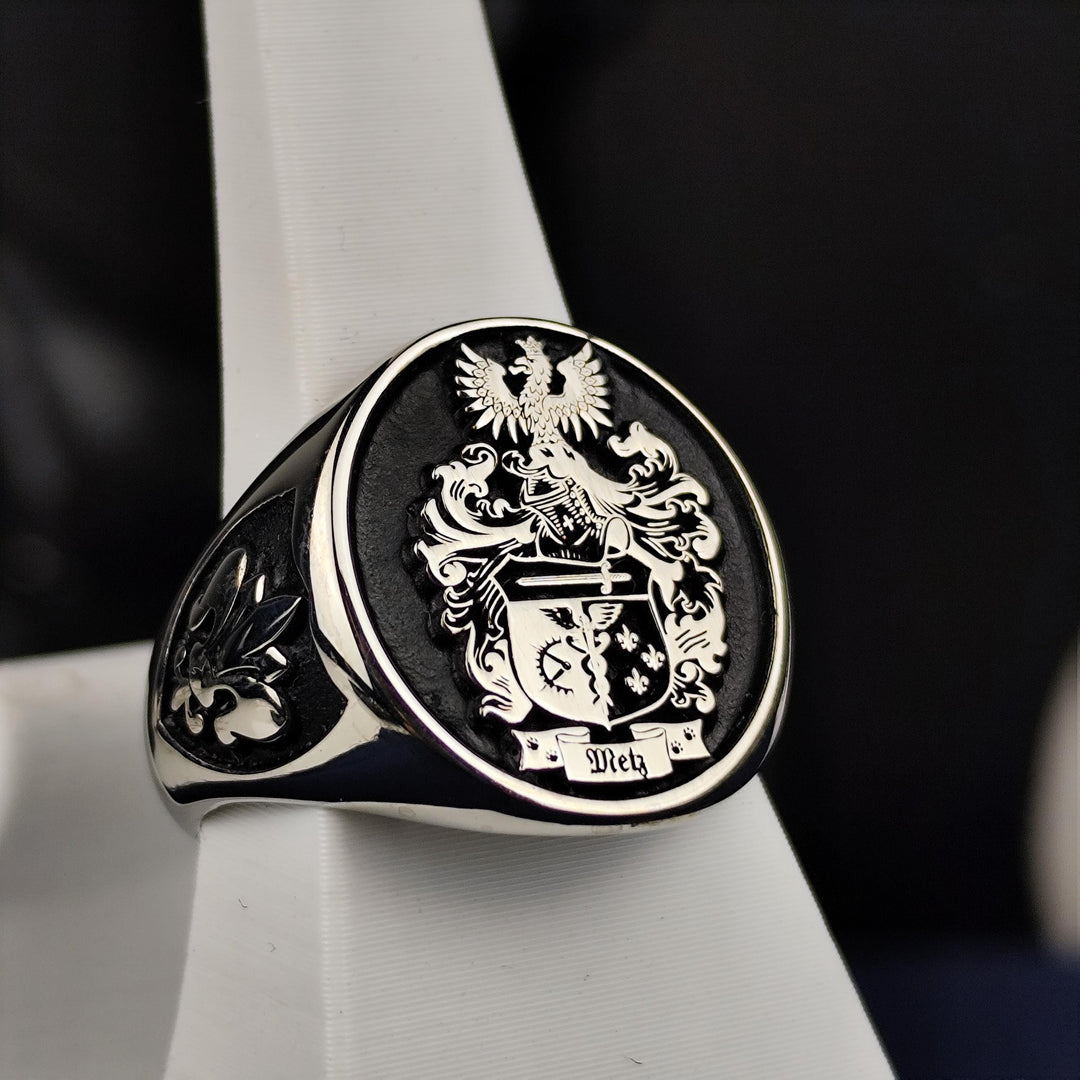 Silver heirloom ring with an engraved family crest, perfect for celebrating ancestry. A thoughtful gift for those who value tradition.