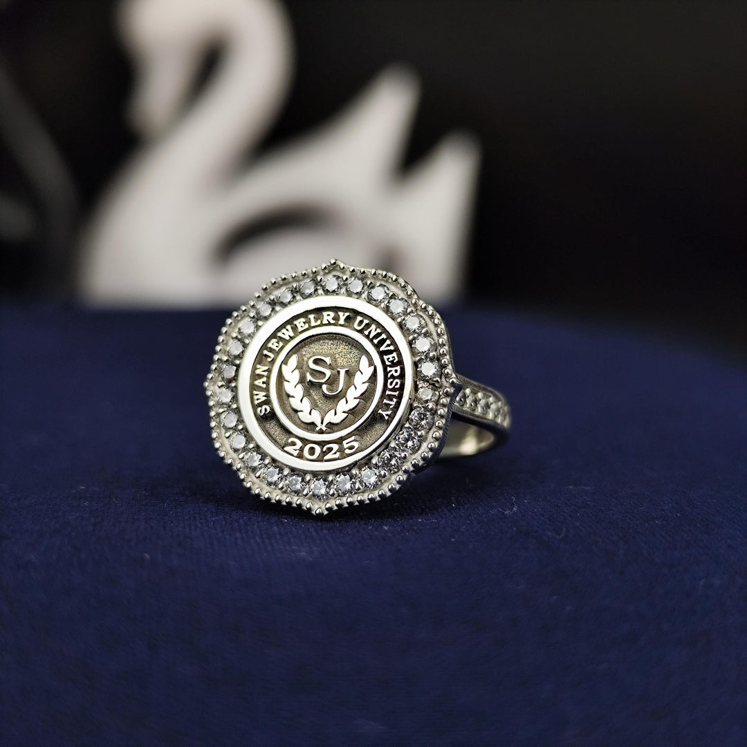 Custom women’s university ring with a white stone centerpiece, offering timeless elegance. Ideal for graduates or alumni looking to commemorate milestones.