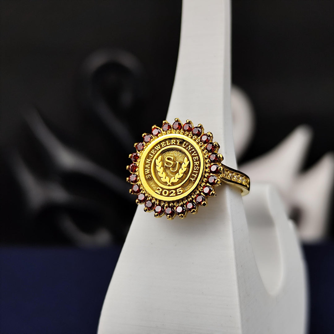 Custom red stone women’s university ring in gold plating, blending bold design with elegant craftsmanship. A perfect keepsake for graduates.
