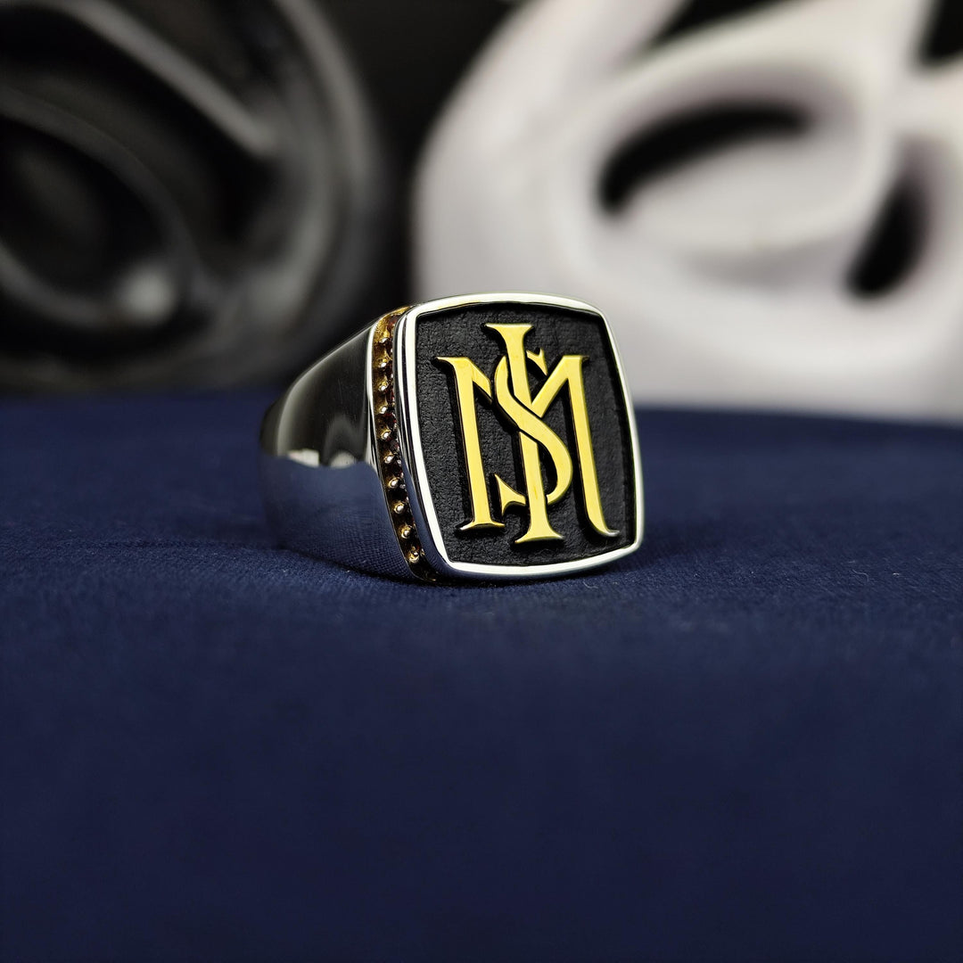 Sleek silver stone ring for men, featuring two engraved initials and a polished finish. Ideal for those who value unique, personalized jewelry that combines timeless elegance with a touch of modern sophistication.