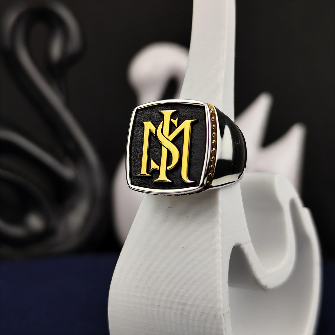 Custom silver ring for men, featuring a two-initial engraving and a sleek stone design. A meaningful and stylish choice for everyday wear or special occasions.