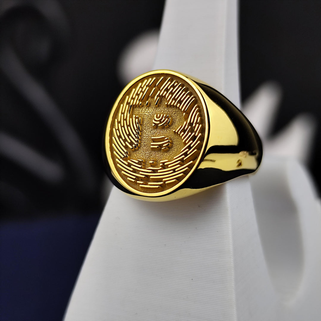 Personalized gold crypto ring with an engraved Bitcoin symbol, perfect for marking milestones in the world of digital currency.