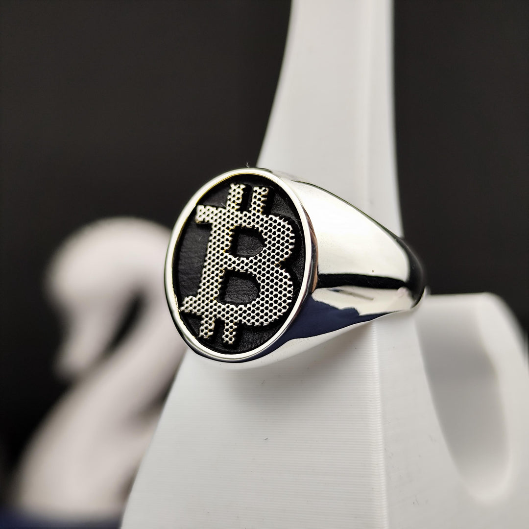 Minimalist silver Bitcoin jewelry with a bold BTC emblem, designed for those passionate about decentralized finance and modern investments.
