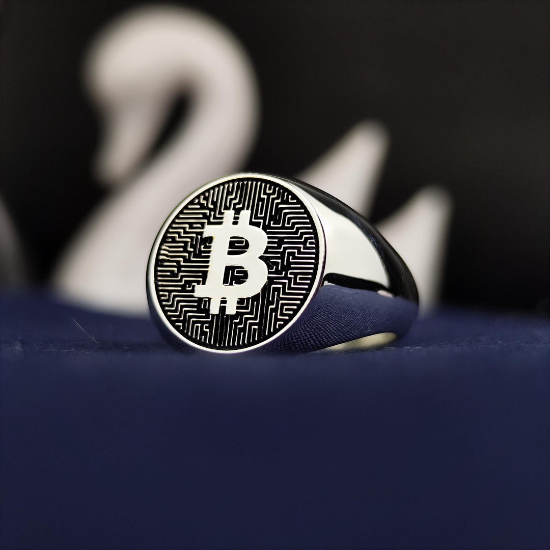 Minimalist Bitcoin ring crafted in sterling silver, offering a bold and sleek design. Ideal for everyday wear or special occasions for blockchain enthusiasts.