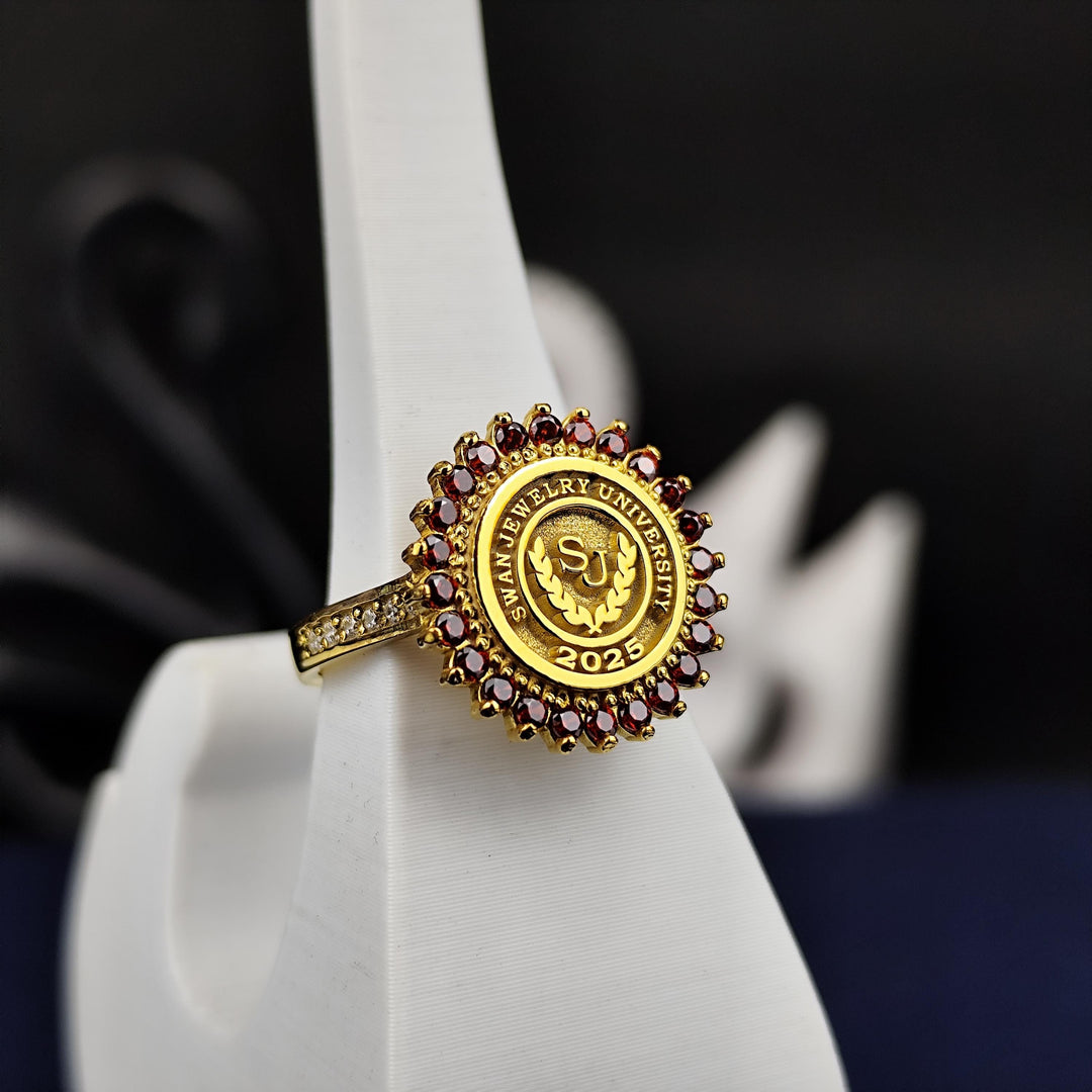 Stylish women’s gold university ring with a red stone centerpiece, designed to blend modern elegance with timeless charm. A meaningful graduation gift.