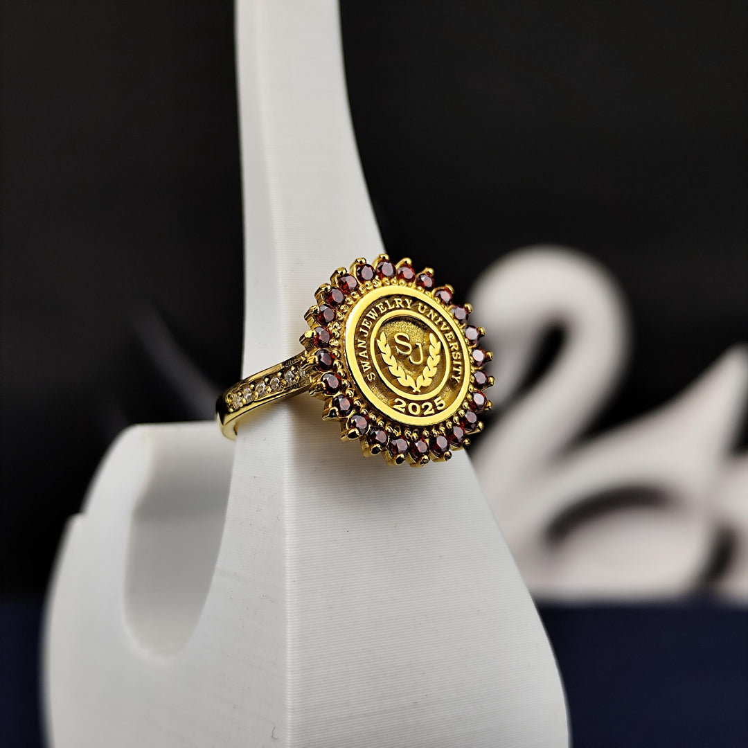 Elegant round university ring with a red stone, crafted in gold plating for women who value meaningful and stylish jewelry. A thoughtful graduation accessory.
