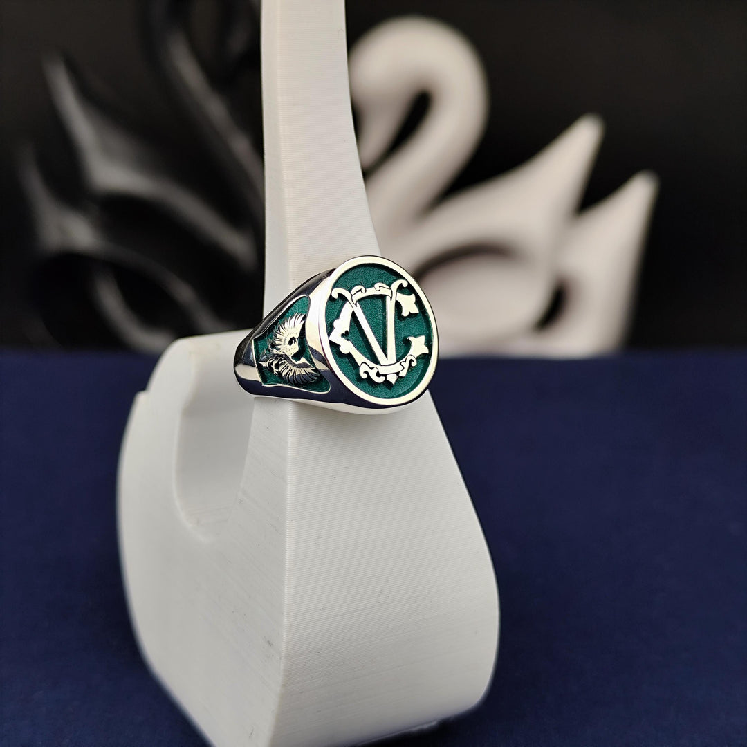 A sophisticated and sleek two-letter ring, this custom signet design features engraved initials or a surname. A timeless and versatile jewelry piece, it is ideal for men and women. Whether as a wedding keepsake, anniversary gift, or a stylish everyday ring, this unique accessory offers elegance and personal meaning.