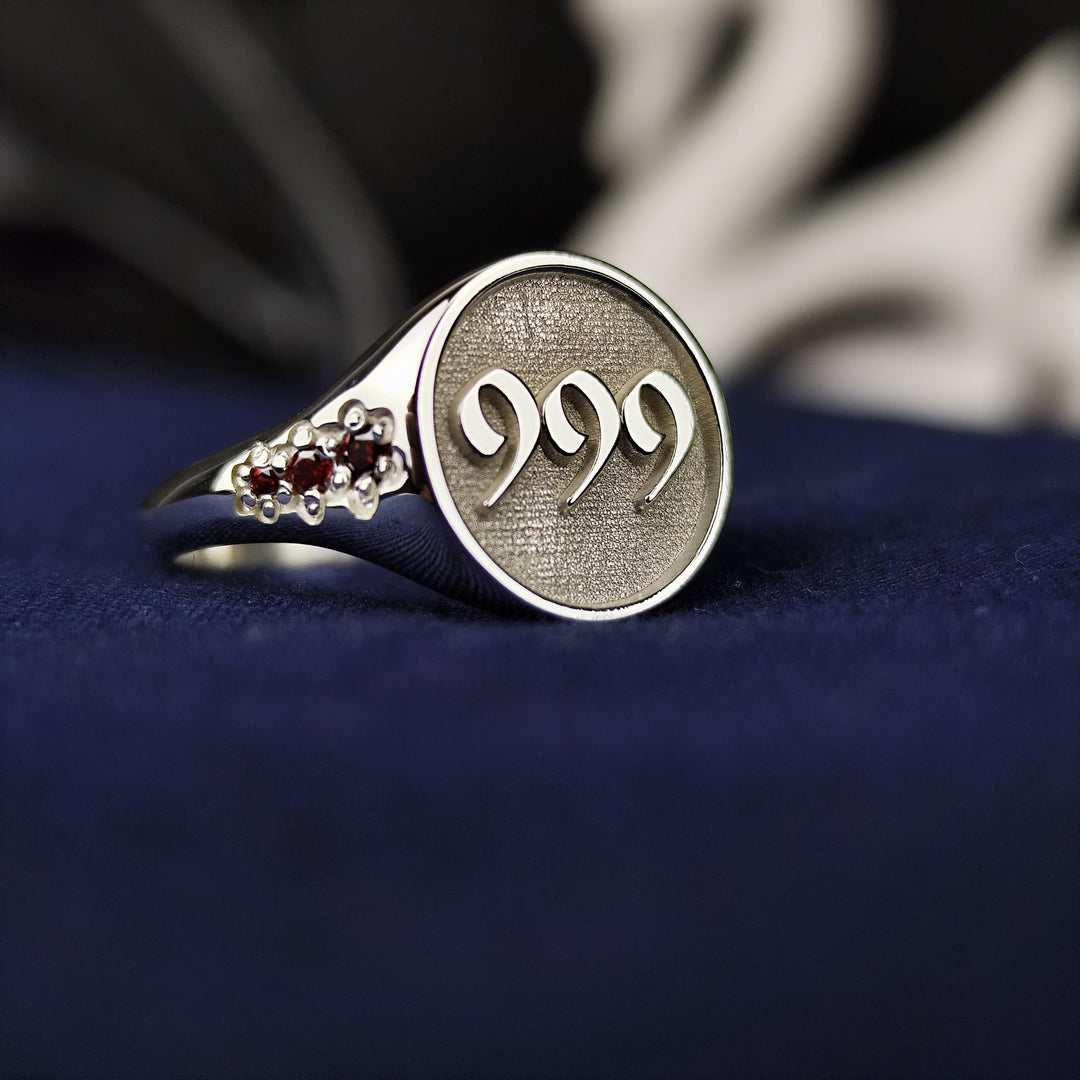 Elegant silver angel number ring featuring a sleek design and a subtle stone accent. This refined piece blends spirituality with modern aesthetics, making it a perfect gift or personal keepsake.