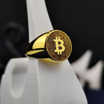 Load image into Gallery viewer, Custom-designed gold Bitcoin signet ring, blending modern elegance with a symbolic blockchain theme. A meaningful keepsake for crypto lovers.