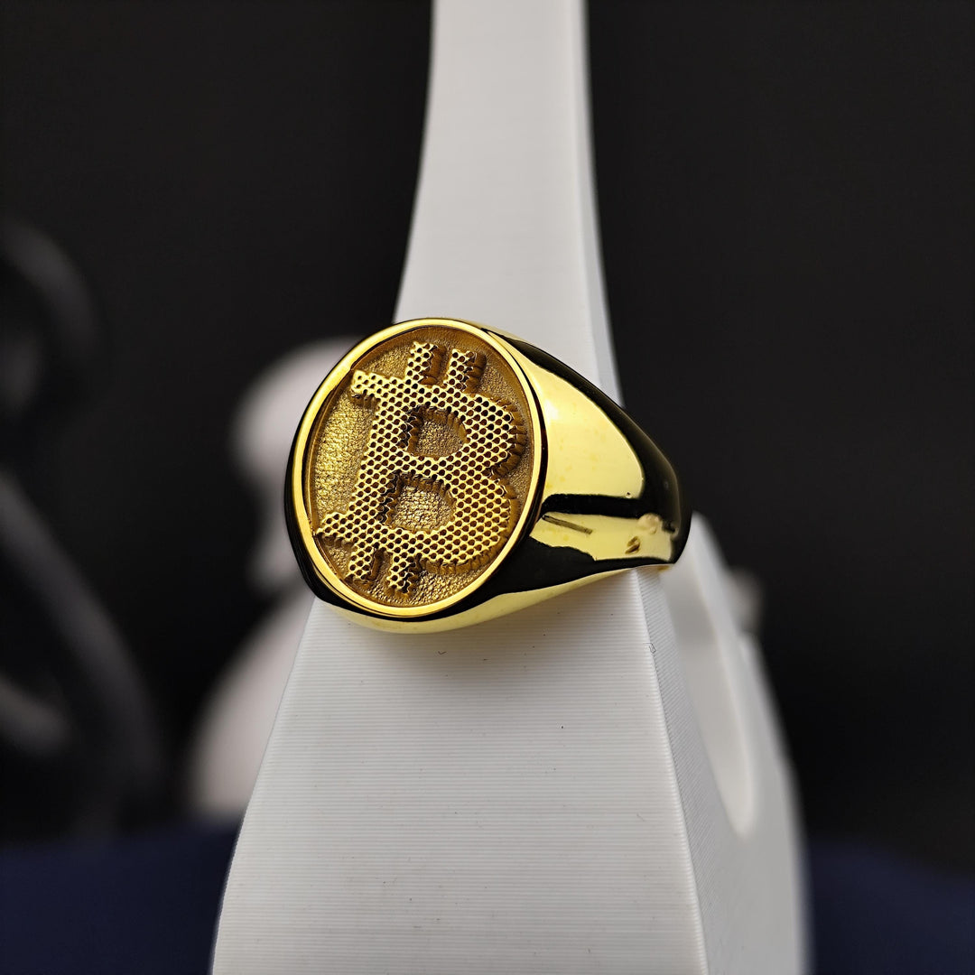 Fashion-forward Bitcoin signet ring, an essential accessory for those who believe in the power of digital currency. Crafted in gold for lasting elegance.
