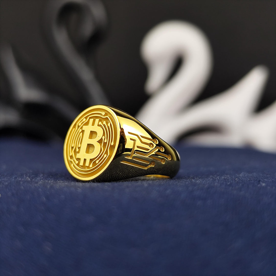 Custom-designed BTC ring, perfect for showcasing cryptocurrency passion. Crafted in gold with intricate details that reflect digital wealth and investment.
