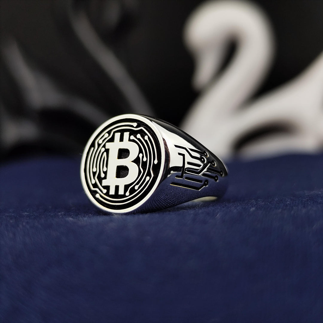 Stylish Bitcoin band ring in silver, perfect for showcasing your love for digital currency. A trendy and meaningful accessory for blockchain enthusiasts.