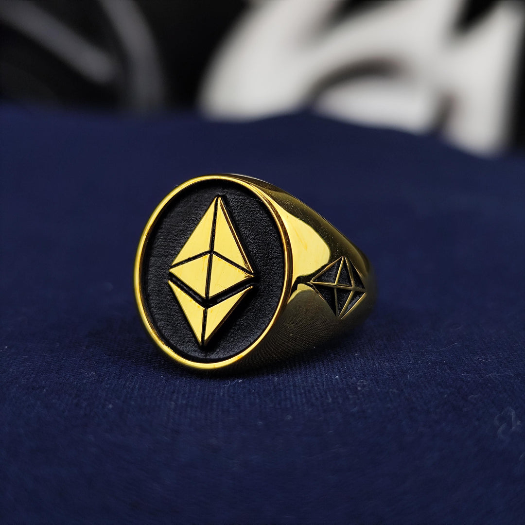 Stylish Ethereum ring crafted with precision in gold plating, making it a perfect accessory for blockchain enthusiasts. This elegant crypto signet ring embodies financial freedom, decentralization, and the future of digital investments. Ideal for tech-savvy individuals, crypto investors, and those who appreciate the power of blockchain technology, making it a valuable addition to any jewelry collection.
