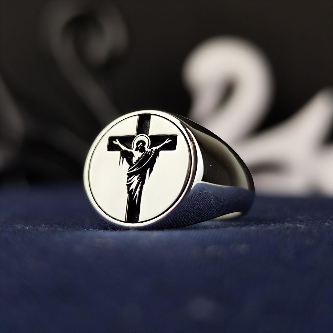 This unisex cross and Jesus ring is a unique religious jewelry piece, crafted in silver with a handmade crucifix signet band. Designed for those who cherish their Christian faith, this elegant ring is perfect for daily wear or special occasions like Christmas and Easter. A thoughtful Christian gift for believers, it blends timeless beauty with deep spiritual meaning, making it a powerful symbol of devotion.
