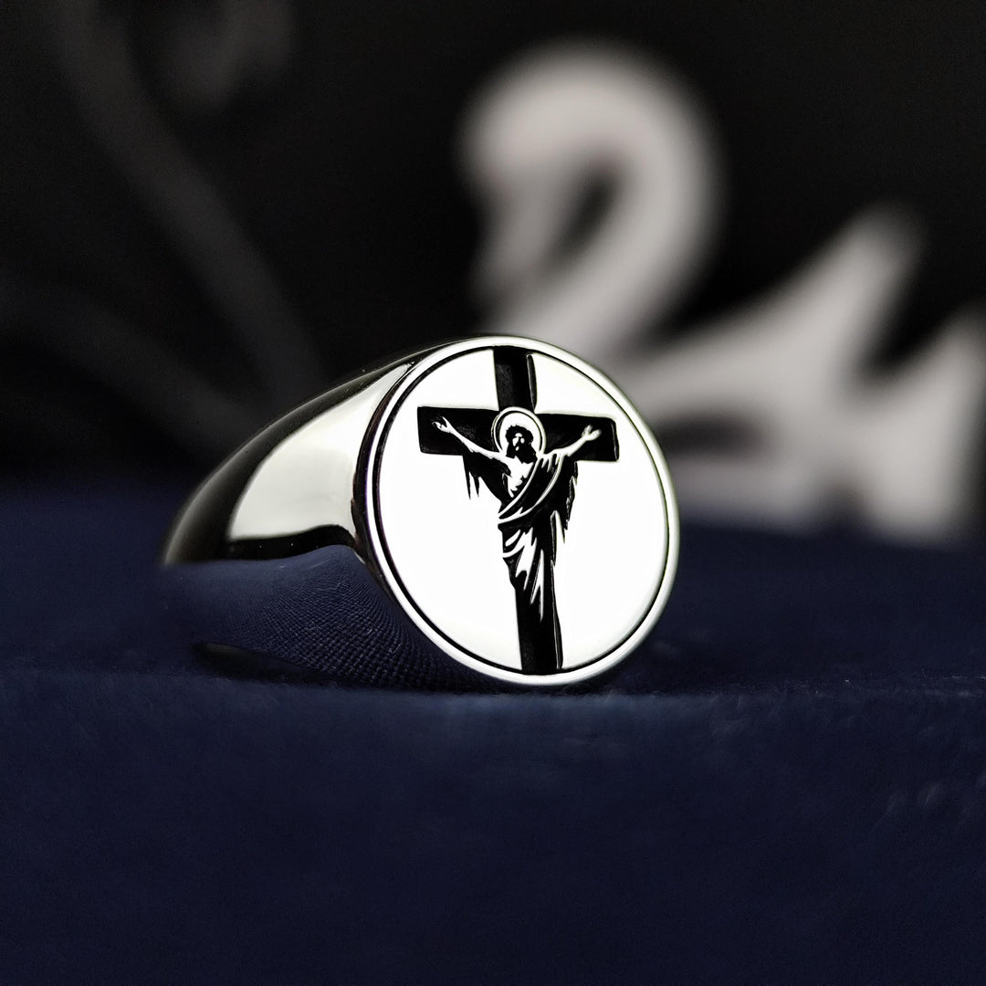 A beautifully crafted unisex Jesus and cross ring, handmade from silver for those who value faith and style. This crucifix signet band is a meaningful Christian jewelry piece, ideal for believers seeking a timeless expression of devotion. Perfect for men and women, this ring makes a thoughtful Christian gift for Easter, Christmas, or any spiritual occasion, offering a blend of elegance and religious symbolism.