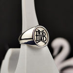 Load image into Gallery viewer, A timeless two-letter monogram ring, crafted with care in silver or gold. This personalized initial name signet ring is perfect for those seeking a unique and stylish accessory. Whether for men or women, it serves as a meaningful custom jewelry piece, making it an ideal gift for special occasions. Elegant, sophisticated, and deeply personal, this custom letter ring adds a refined touch to any collection.