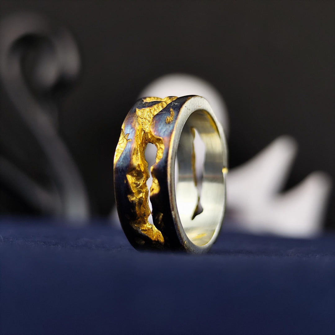 A beautifully handcrafted rustic ring featuring a unique oxidized and gold-plated finish. Its textured surface and distressed look add a vintage touch, making it an ideal statement piece for those who love artistic, bold jewelry. Designed for both men and women, this ring is a timeless combination of antique charm and modern craftsmanship, perfect for wearing as a daily accessory or gifting on special occasions.