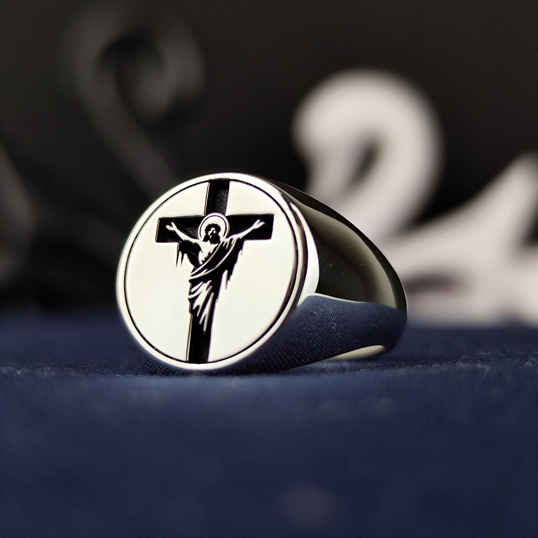 Designed for men and women, this unisex silver cross and Jesus ring features a handmade crucifix signet band, symbolizing faith and devotion. A stylish and meaningful religious jewelry piece, it is perfect for Easter, Christmas, or everyday wear. Whether as a Christian gift or a personal keepsake, this ring carries deep spiritual significance, offering an elegant expression of belief and commitment.