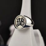 Load image into Gallery viewer, This handcrafted monogram ring is a stunning personalized accessory featuring two initials. A timeless custom name ring, it’s available in silver or gold, offering a classic look for men and women. Whether worn as a daily reminder of a loved one or gifted on a special occasion, this elegant signet ring is a meaningful and stylish choice for those who love unique jewelry.