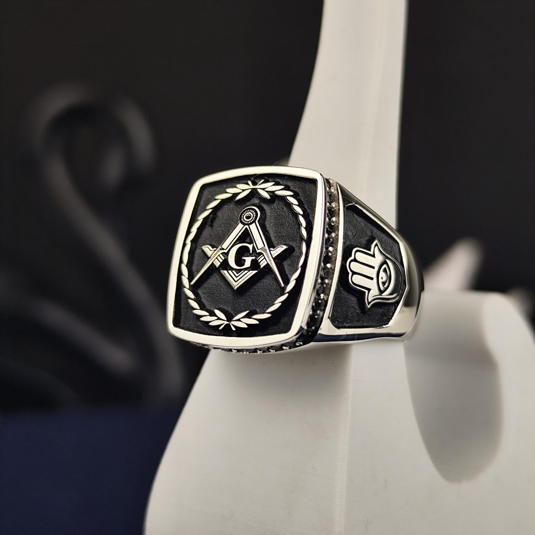 A bold and elegant Master Mason ring featuring a striking stone centerpiece, crafted for members of the Masonic brotherhood. Made from silver or gold, this lodge signet ring is a symbol of enlightenment and dedication. Perfect for everyday wear or formal ceremonies, this Masonic ring is a powerful statement piece that embodies the strength and unity of Freemasonry, making it a treasured keepsake.