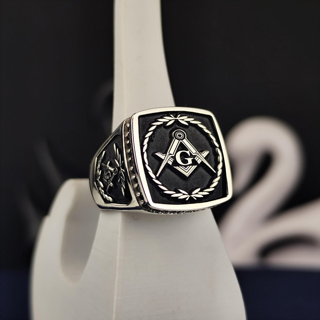 This stunning Masonic lodge ring features a bold stone set in an intricately designed signet band, symbolizing wisdom and fraternity. Handmade in silver or gold, this Master Mason ring is a perfect representation of tradition and heritage. Whether as a personal keepsake or a meaningful gift for a fellow Freemason, this detailed ring is an elegant tribute to the timeless values of Freemasonry.
