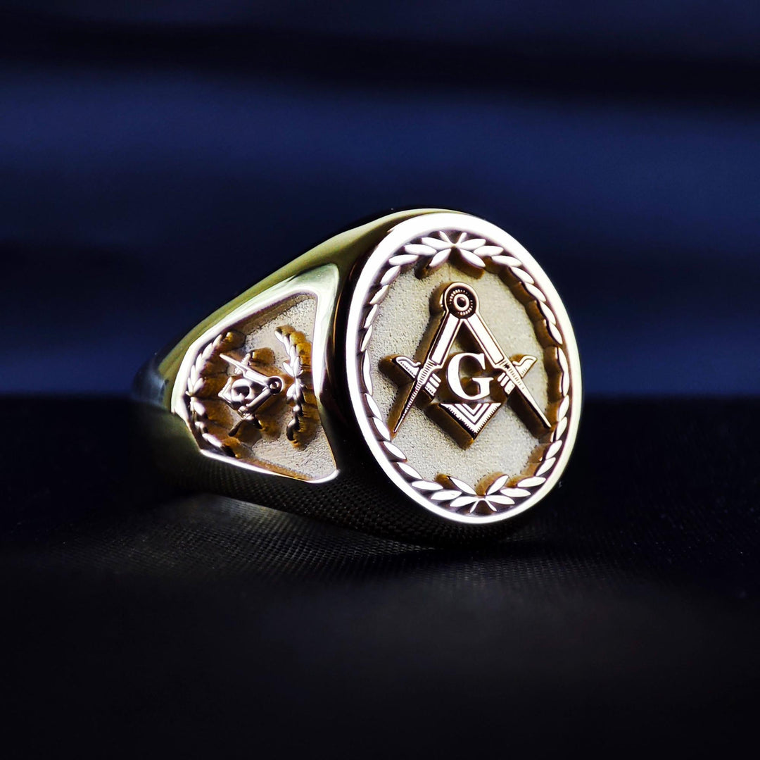 This custom gold plated Masonic ring features a detailed Freemason emblem, ornate side patterns, and optional personalization such as initials or lodge number. With its bold and symbolic design, this ring is ideal for men who honor their Masonic heritage. Crafted with care, it blends traditional meaning with timeless style. A powerful accessory for daily wear or special Masonic ceremonies, it makes an excellent gift or personal keepsake.