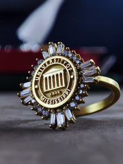 A sophisticated women's university ring, crafted in gold plating for a luxurious finish. Designed as a stylish and elegant class ring, this piece is a perfect graduation gift or alumni keepsake. Whether worn as a symbol of academic success or a daily statement piece, this beautifully crafted college ring is both modern and timeless.