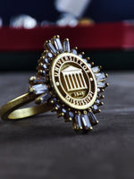 Load image into Gallery viewer, Celebrate your academic journey with this gold-plated women&#39;s university ring, featuring a sleek and elegant design. A stylish and meaningful graduation gift, this college signet ring is perfect for students, alumni, and those looking for a classic university jewelry piece. A timeless and versatile addition to any collection.
