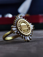 Load image into Gallery viewer, This stunning gold-plated university ring for women is a refined and delicate jewelry piece that represents success and achievement. Designed for students and alumni, this elegant class ring is ideal for celebrating graduation. With its minimalist yet sophisticated design, it is perfect for stacking or wearing alone as a meaningful keepsake.
