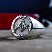 A vintage-inspired Masonic ring, crafted in sterling silver and adorned with a hand-engraved leaf pattern. The central Masonic emblem symbolizes knowledge and unity, making this ring a powerful representation of brotherhood. A bold and sophisticated piece, perfect as a lodge ring or a personal statement accessory.
