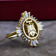 A stunning women's signet ring, engraved with a personalized family crest for a regal and meaningful design. Crafted with elegance and tradition in mind, this heraldic ring symbolizes noble heritage. Whether as an heirloom, a milestone gift, or a refined statement piece, this coat of arms jewelry makes a timeless and sophisticated addition to any collection.