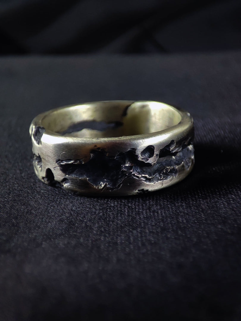 Silver rustic ring with a weathered and worn look, perfect for adding a vintage touch to your collection.
