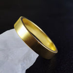 Load image into Gallery viewer, A timeless and sophisticated vermeil ring set, designed for couples who appreciate elegance and meaning in their jewelry. These engagement bands feature a gold-plated sterling silver design, symbolizing love and devotion. Whether for a wedding, engagement, or commitment ceremony, these rings are a beautiful and lasting representation of unity.
