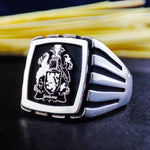 Load image into Gallery viewer, This exquisite family crest ring is a bold and stylish signet piece, crafted in high-quality silver. Featuring a square design with a personalized engraving of a family emblem, initials, or coat of arms, it is a perfect gift for men who value history and tradition. An elegant way to carry personal heritage, this ring is designed for both formal and everyday wear.

