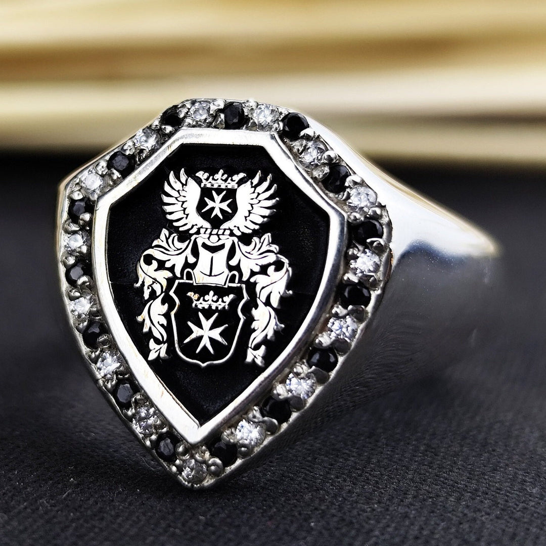 Personalized family crest ring, featuring a custom coat of arms engraving. Available in gold or silver, this ring represents family heritage, making it a meaningful heirloom or unique gift.
