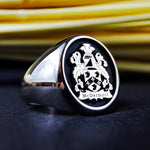 Load image into Gallery viewer, This heraldic silver family crest ring is a stunning custom signet, featuring an engraved coat of arms. Designed for those who value heritage, nobility, and tradition, this heirloom jewelry piece symbolizes family pride. Crafted in sterling silver, this elegant ring makes a timeless statement and a meaningful gift for history lovers, collectors, and those honoring their lineage.
