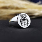 Load image into Gallery viewer, This custom engraved family crest ring is a timeless piece of heritage jewelry, featuring a recessed coat of arms design. Crafted in high-quality metal, this round signet ring is perfect for men who appreciate tradition and noble ancestry. A meaningful heirloom, it can be customized with a family emblem or initials, making it an ideal gift for special occasions such as anniversaries, birthdays, or graduations.
