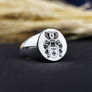 This custom engraved family crest ring is a timeless piece of heritage jewelry, featuring a recessed coat of arms design. Crafted in high-quality metal, this round signet ring is perfect for men who appreciate tradition and noble ancestry. A meaningful heirloom, it can be customized with a family emblem or initials, making it an ideal gift for special occasions such as anniversaries, birthdays, or graduations.