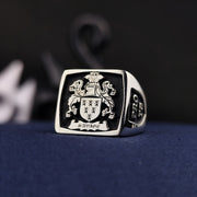 This square heraldic family crest ring is crafted in high-quality silver and enhanced with black enamel detailing. Featuring a custom engraved coat of arms, this signet ring is a bold symbol of heritage and nobility. Designed for those who appreciate history and elegance, it is a perfect heirloom piece, ideal as a meaningful gift for special occasions or personal legacy preservation.
