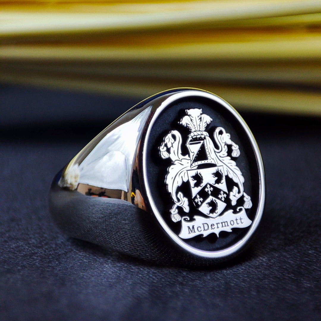 A classic silver family crest ring with a custom coat of arms engraving, crafted for those who appreciate their lineage. This heraldic signet ring blends tradition with modern craftsmanship, making it a perfect heirloom jewelry piece. A stunning and regal design, ideal for marking milestones and celebrating noble ancestry.