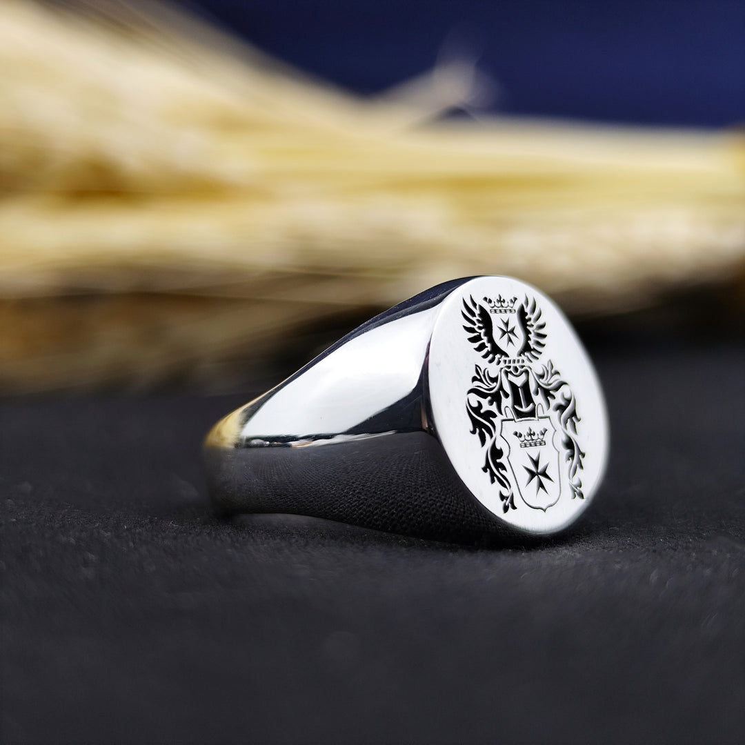 Designed for men who appreciate history and tradition, this round signet ring features a deep-engraved family crest or initials. Made for durability and style, this noble heritage ring is a meaningful accessory that embodies personal legacy. An ideal choice for weddings, anniversaries, or milestone celebrations, this elegant coat of arms jewelry carries deep symbolism and timeless sophistication.